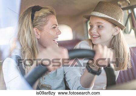 Mother and daughter in car together, smiling View Large Photo Image Stock Photo - Mother and daughter in car together, smiling. Fotosearch