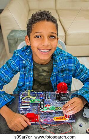 Portrait of boy with science project, smiling View Large Photo Image Stock Photography - Portrait of boy with science project, smiling. Fotosearch