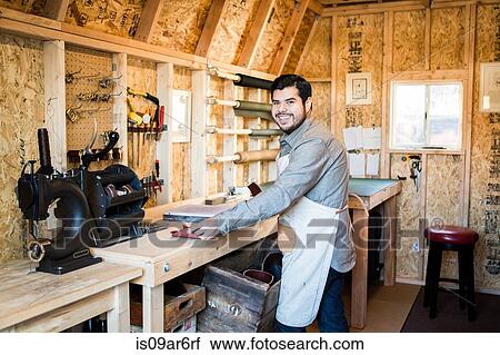 Portrait of leather craftsman in workshop View Large Photo Image Stock Image - Portrait of leather craftsman in workshop. Fotosearch