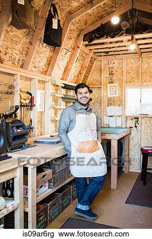 Portrait of leather craftsman leaning against workshop bench View Large Photo Image Stock Image - Portrait of leather craftsman leaning against workshop bench. Fotosearch