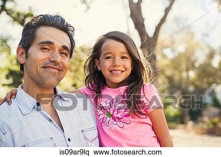 Portrait of mid adult man and daughter in community garden View Large Photo Image Stock Photography - Portrait of mid adult man and daughter in community garden. Fotosearch