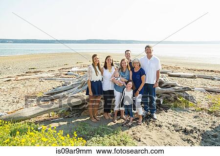 Picture - Portrait of three generation family on beach. Fotosearch