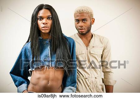 Stock Image - Portrait of two fashionable young men. Fotosearch