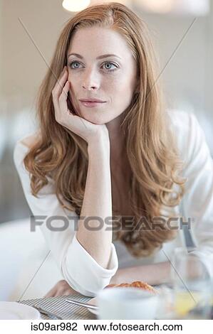 Portrait of young businesswoman having breakfast in hotel restaurant View Large Photo Image Stock Image - Portrait of young businesswoman having breakfast in hotel restaurant. Fotosearch