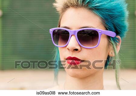 Portrait of young woman with colourful hair, wearing sunglasses View Large Photo Image Stock Photo - Portrait of young woman with colourful hair, wearing sunglasses. Fotosearch