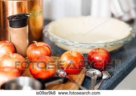 Red apples on kitchen counter in preparation for apple pie View Large Photo Image Stock Photo - Red apples on kitchen counter in preparation for apple pie. Fotosearch