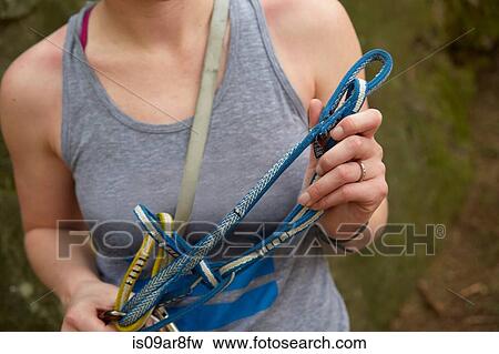 Rock climber preparing safety harness View Large Photo Image Stock Photo - Rock climber preparing safety harness. Fotosearch