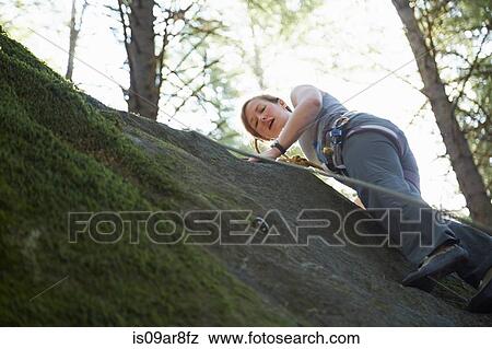 Stock Photo - Rock climber scaling rock. Fotosearch