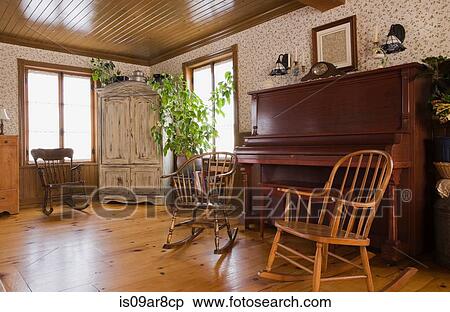 Rocking chairs and piano in the living room of house View Large Photo Image Stock Photography - Rocking chairs and piano in the living room of house. Fotosearch