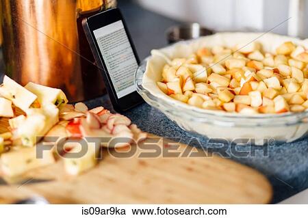 Smartphone recipe for apple pie preparation with chopped apples in raw pastry View Large Photo Image Stock Image - Smartphone recipe for apple pie preparation with chopped apples in raw pastry. Fotosearch
