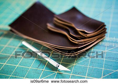 Stack of cut leather pieces and scalpel on cutting mat View Large Photo Image Stock Image - Stack of cut leather pieces and scalpel on cutting mat. Fotosearch