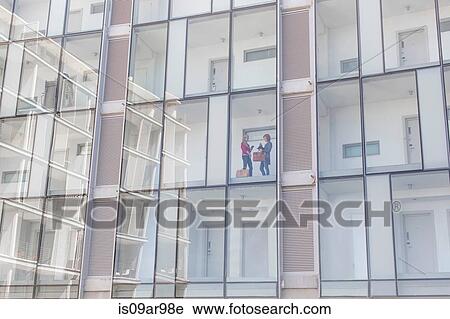 Two businesswomen chatting in corridor of glass fronted hotel View Large Photo Image Stock Image - Two businesswomen chatting in corridor of glass fronted hotel. Fotosearch