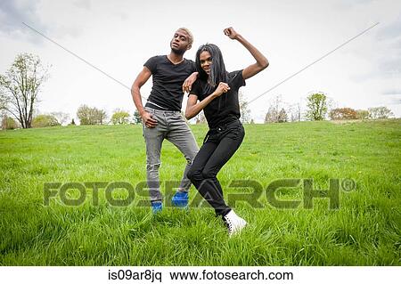 Stock Photography - Two young men posing in park. Fotosearch