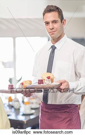 Stock Image - Waiter in restaurant. Fotosearch