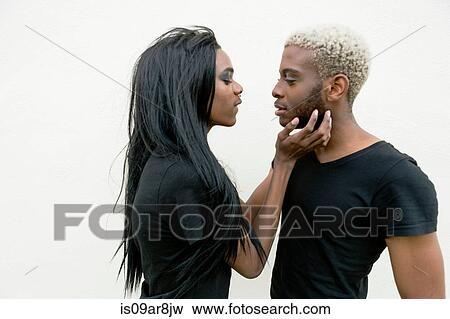 Stock Photo - Young male couple face to face. Fotosearch