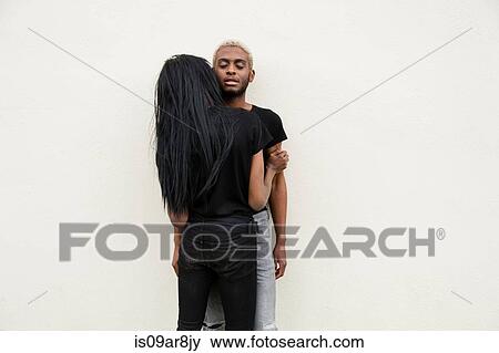 Stock Photo - Young male couple hugging. Fotosearch