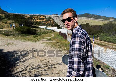 Picture - Young man at countryside, Upland, California, USA. Fotosearch