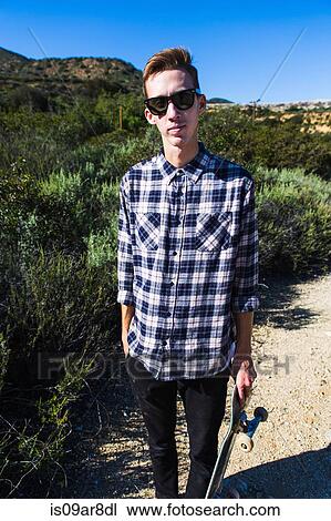Young man at countryside, Upland, California, USA View Large Photo Image Stock Image - Young man at countryside, Upland, California, USA. Fotosearch