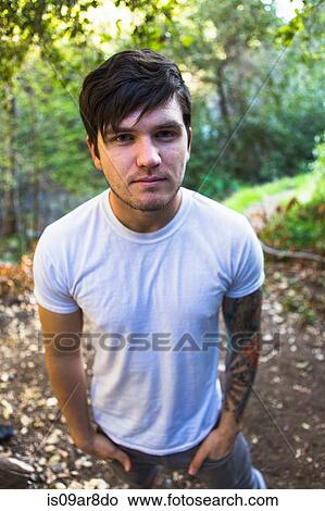 Young man in woods, Upland, California, USA View Large Photo Image Picture - Young man in woods, Upland, California, USA. Fotosearch