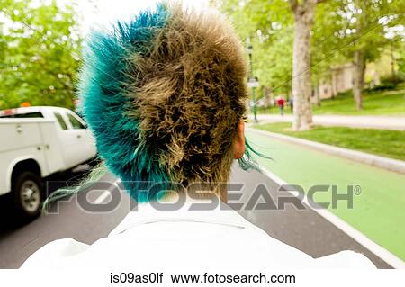 Stock Image - Young woman with colourful hair, rear view, close-up. Fotosearch