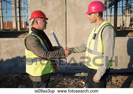 Architect and surveyor shaking hands on construction site View Large Photo Image Stock Photography - Architect and surveyor shaking hands on construction site. Fotosearch