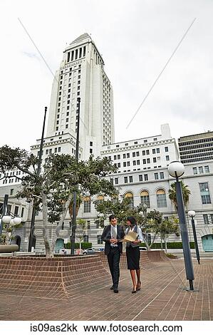 Business people walking across tiled floor, Los Angeles City Hall, California, USA View Large Photo Image Stock Image - Business people walking across tiled floor, Los Angeles City Hall, California, USA. Fotosearch