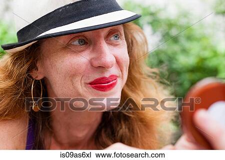 Close up portrait of blue eyed mid adult woman with red hair View Large Photo Image Stock Image - Close up portrait of blue eyed mid adult woman with red hair. Fotosearch