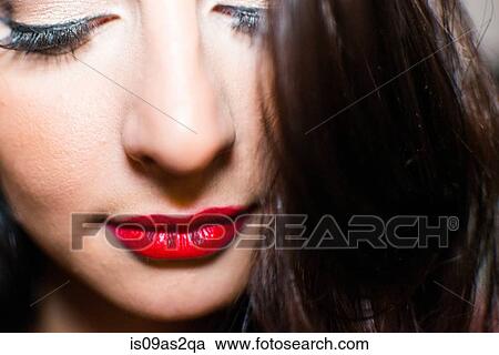 Close up portrait of glamorous young woman wearing red lipstick View Large Photo Image Stock Image - Close up portrait of glamorous young woman wearing red lipstick. Fotosearch