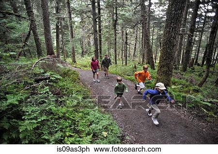 Stock Image - Family exploring woods, Winner Creek, Alyeska Resort, Turnagain Arm, Mt. Alyeska, Girdwood, Alaska, USA. Fotosearch