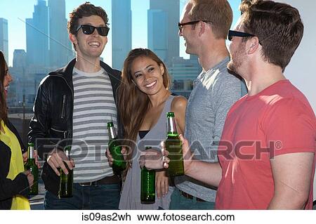 Five adult friends drinking beer at rooftop bar with Los Angeles skyline, USA View Large Photo Image Stock Image - Five adult friends drinking beer at rooftop bar with Los Angeles skyline, USA. Fotosearch