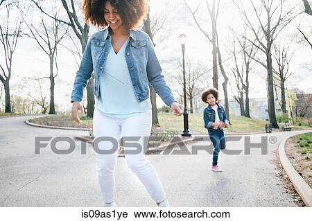 Front view of mother and daughter playing hopscotch View Large Photo Image Stock Image - Front view of mother and daughter playing hopscotch. Fotosearch