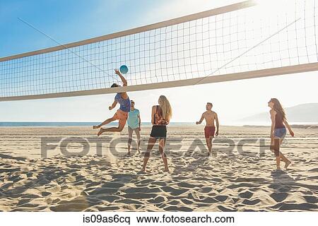 Group of friends playing volleyball on beach View Large Photo Image Stock Photography - Group of friends playing volleyball on beach. Fotosearch