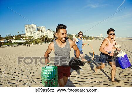 Group of friends, running towards beach View Large Photo Image Stock Photo - Group of friends, running towards beach. Fotosearch