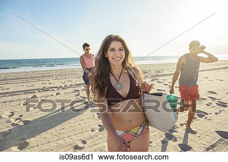 Group of friends walking on beach View Large Photo Image Stock Image - Group of friends walking on beach. Fotosearch