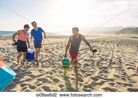 Group of friends walking on beach View Large Photo Image Stock Image - Group of friends walking on beach. Fotosearch