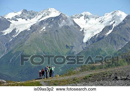 Stock Image - Group of people looking at view, Mighty Might Trail, Alyeska Resort, seven glaciers, Winner Creek Valley, Turnagain Arm, Mt. Alyeska, Girdwood, Alaska, USA. Fotosearch