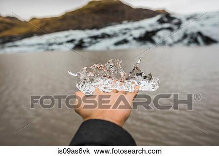 Hand of female tourist holding ice at Solheimajokull, Iceland View Large Photo Image Stock Image - Hand of female tourist holding ice at Solheimajokull, Iceland. Fotosearch