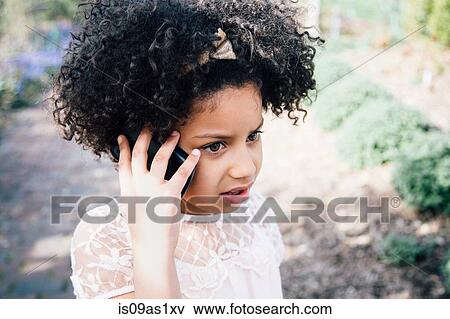 Head and shoulders of girl using smartphone to make a telephone call View Large Photo Image Stock Photo - Head and shoulders of girl using smartphone to make a telephone call. Fotosearch