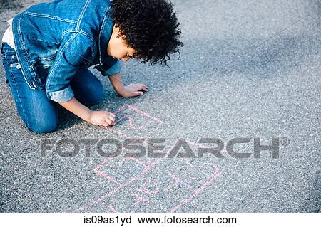High angle view of girl kneeling using chalk to draw hopscotch game View Large Photo Image Stock Image - High angle view of girl kneeling using chalk to draw hopscotch game. Fotosearch