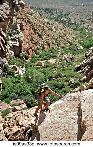 High angle view of hiker using hands to climb up rocks, First Creek, Las Vegas, Nevada, USA View Large Photo Image Stock Photography - High angle view of hiker using hands to climb up rocks, First Creek, Las Vegas, Nevada, USA. Fotosearch