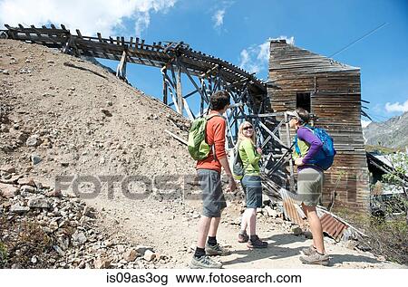 Stock Image - hikers exploring, Hatcher Pass, Matanuska Valley, Palmer, Alaska, USA. Fotosearch