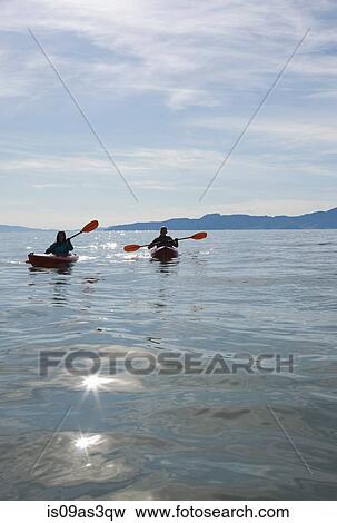 Kayakers sitting in kayaks on water infront of mountain range, Great Salt Lake, Utah, USA View Large Photo Image Stock Photo - Kayakers sitting in kayaks on water infront of mountain range, Great Salt Lake, Utah, USA. Fotosearch