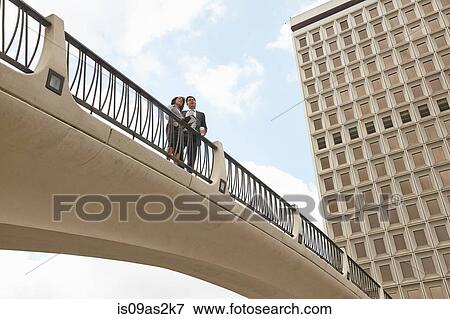 Low angle view of people on footbridge, City Hall East, Los Angeles, California, USA View Large Photo Image Stock Photo - Low angle view of people on footbridge, City Hall East, Los Angeles, California, USA. Fotosearch
