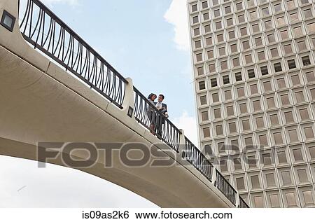 Low angle view of people on footbridge, City Hall East, Los Angeles, California, USA View Large Photo Image Stock Photograph - Low angle view of people on footbridge, City Hall East, Los Angeles, California, USA. Fotosearch