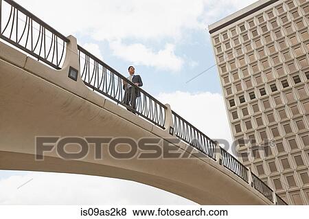 Low angle view of person on footbridge, City Hall East, Los Angeles, California, USA View Large Photo Image Stock Photo - Low angle view of person on footbridge, City Hall East, Los Angeles, California, USA. Fotosearch