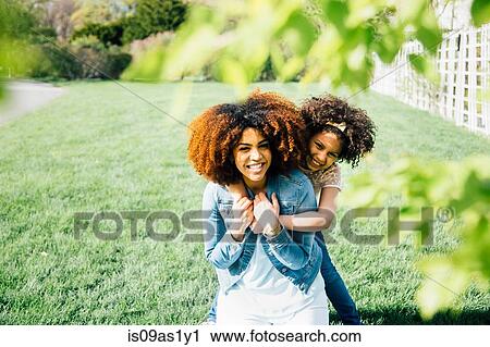 Mother and daughter using binoculars, looking up, pointing View Large Photo Image Stock Image - Mother and daughter using binoculars, looking up, pointing. Fotosearch