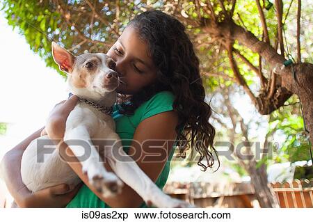 Portrait of girl in garden hugging dog View Large Photo Image Stock Photography - Portrait of girl in garden hugging dog. Fotosearch