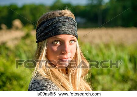 Portrait of pretty young woman with green eyes wearing bandana View Large Photo Image Stock Photography - Portrait of pretty young woman with green eyes wearing bandana. Fotosearch