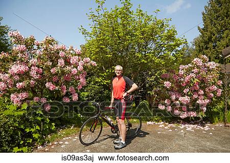 Portrait of senior man with bicycle View Large Photo Image Stock Image - Portrait of senior man with bicycle. Fotosearch