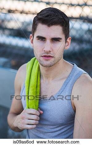 Portrait of young male basketball player with towel on shoulder View Large Photo Image Stock Image - Portrait of young male basketball player with towel on shoulder. Fotosearch